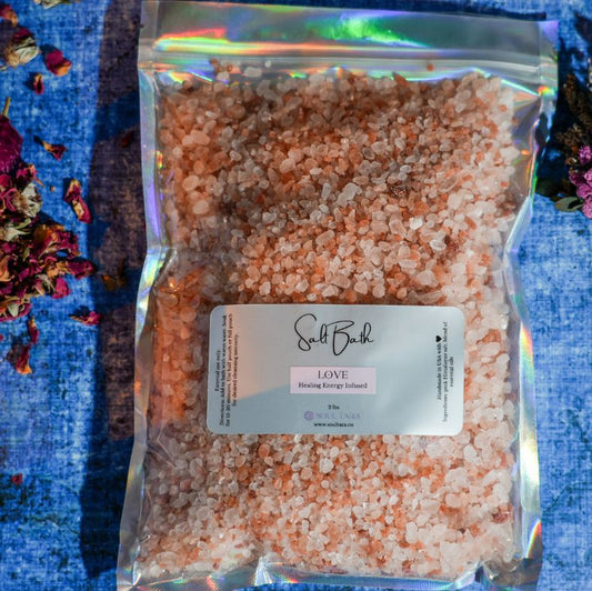 Packaged pink Himalayan salt with a label on a blue fabric background